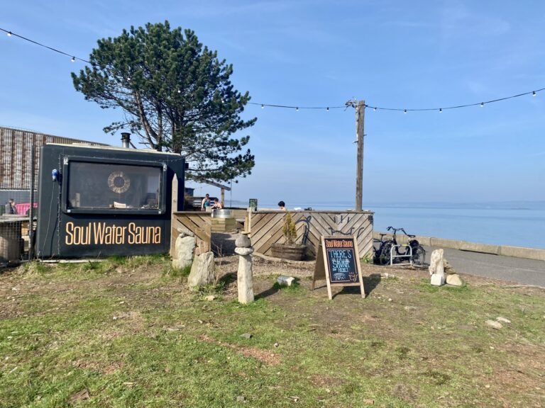Soul Water Sauna Granton by the seafront with outdoor sauna setup, signage and views across the Firth of Forth