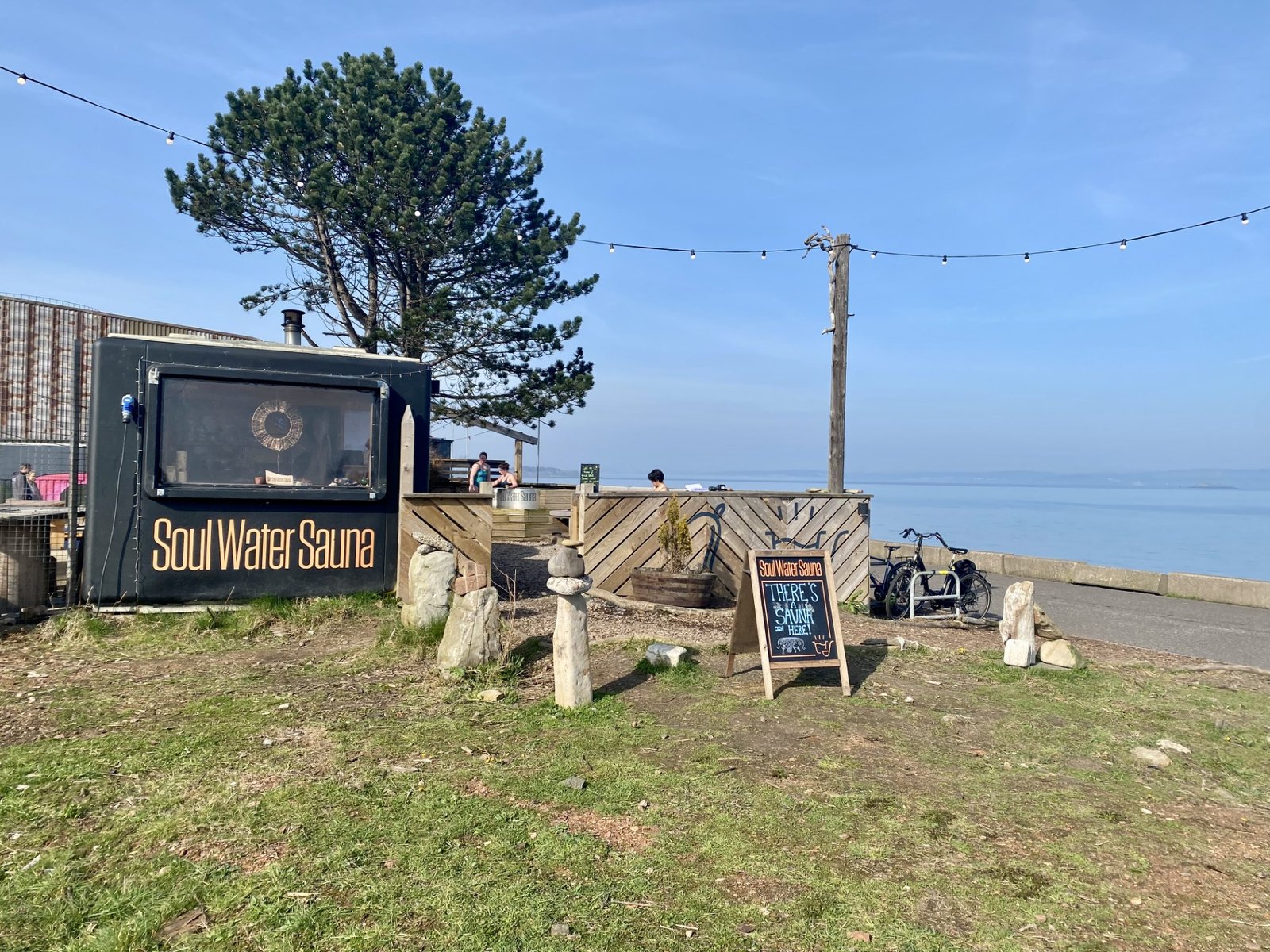 Soul Water Sauna Granton by the seafront with outdoor sauna setup, signage and views across the Firth of Forth
