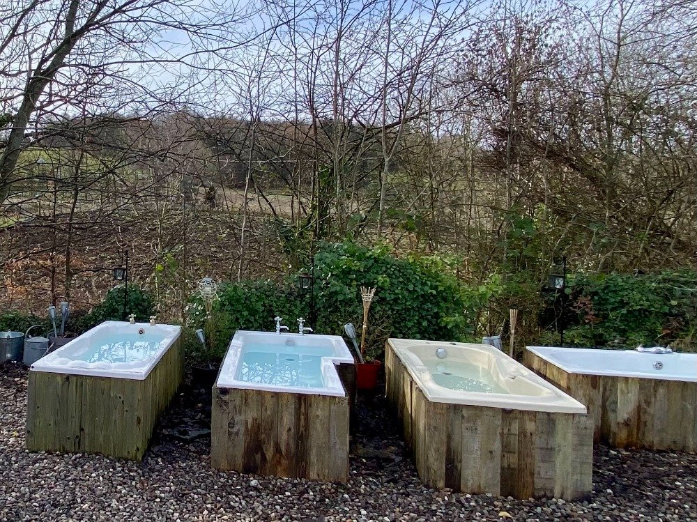 Close-up of outdoor cold plunge baths at Viking Heat Retreat in Fife