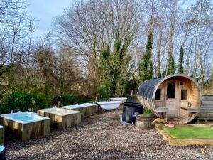 Outdoor sauna and ceramic cold plunge baths at Viking Heat Retreat in Fife