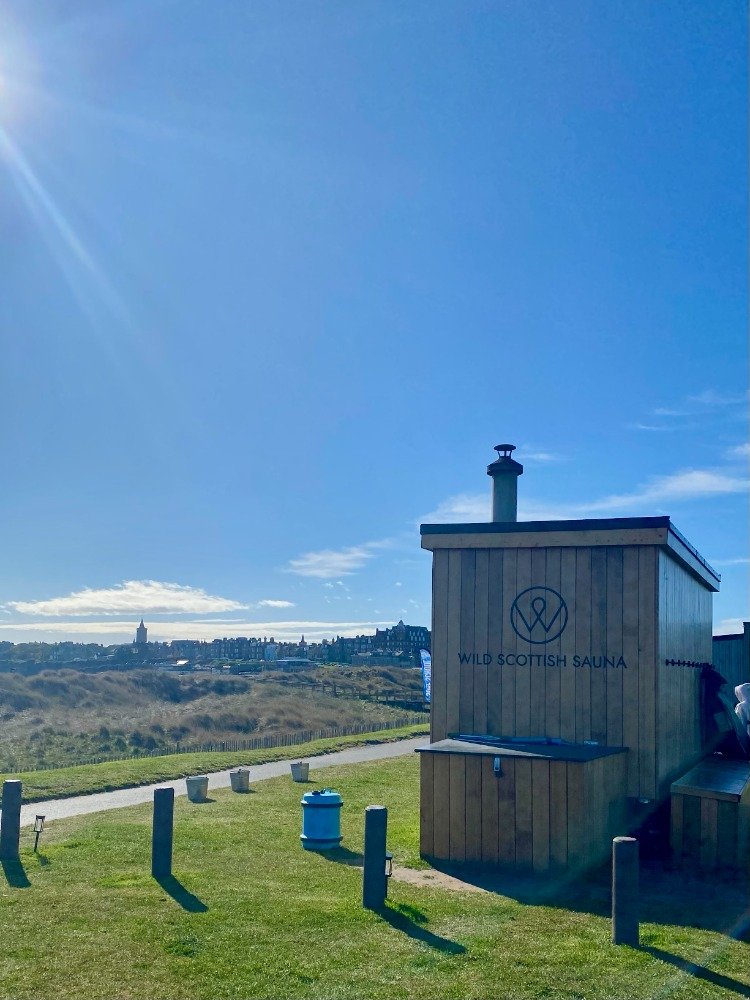 Wood-fired sauna at West Sands in St Andrews with views towards the town skyline