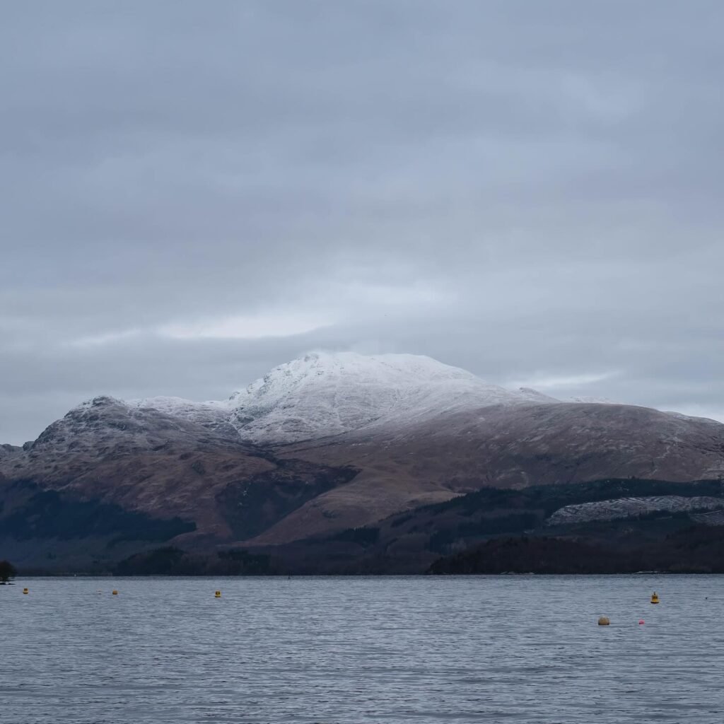View of Ben Lomond across Loch Lomond from the shoreline near Luss