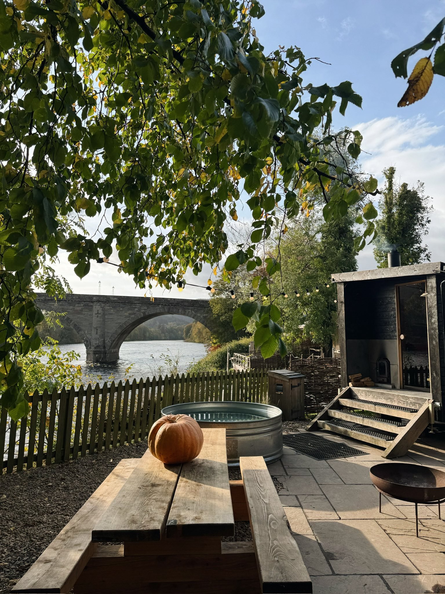 Riverside sauna and plunge pool at Braan Sauna in Dunkeld overlooking the River Tay and Dunkeld Bridge