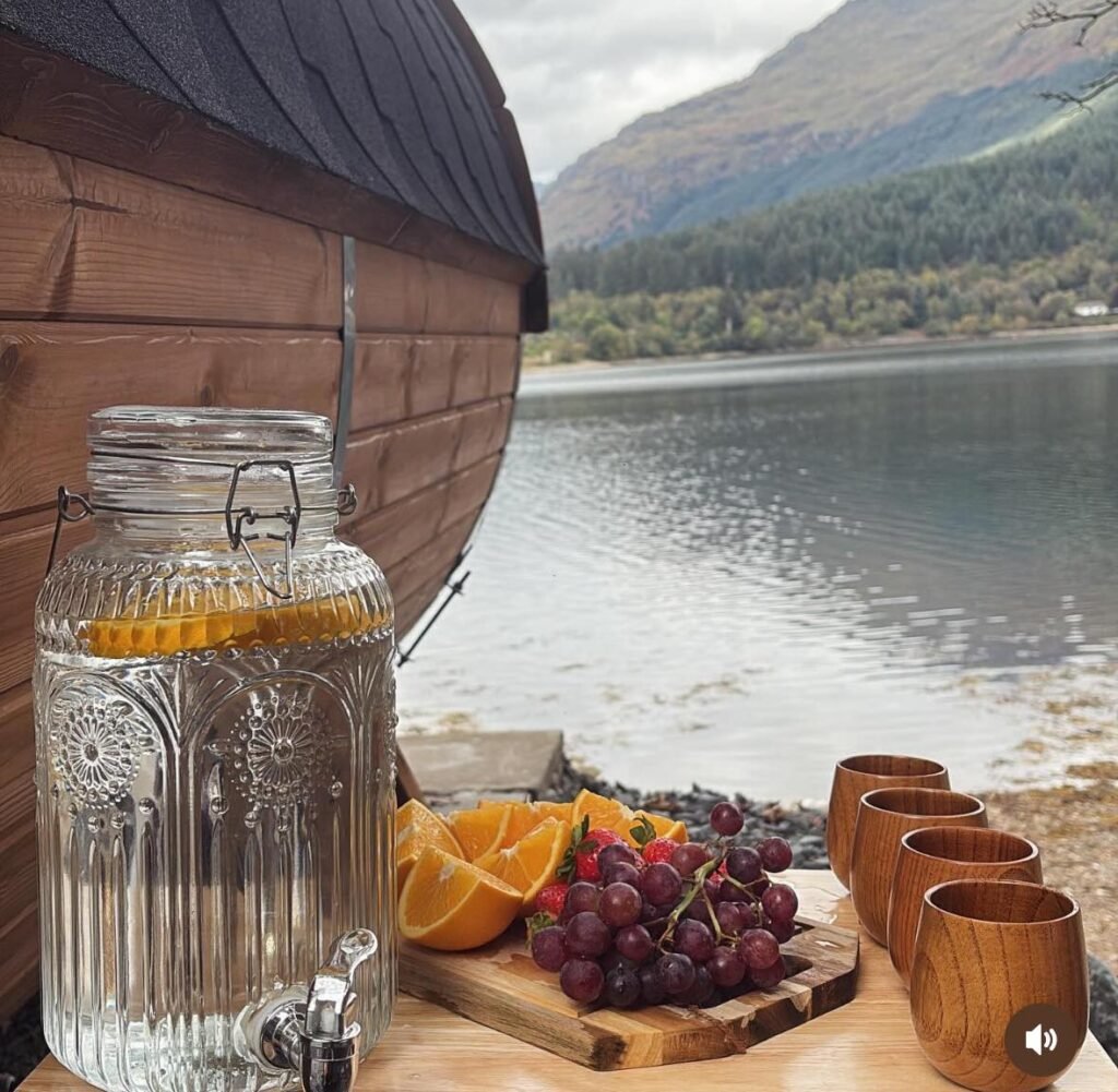 Drinks and fruit set out beside Loch Long at Eir Sauna in Arrochar