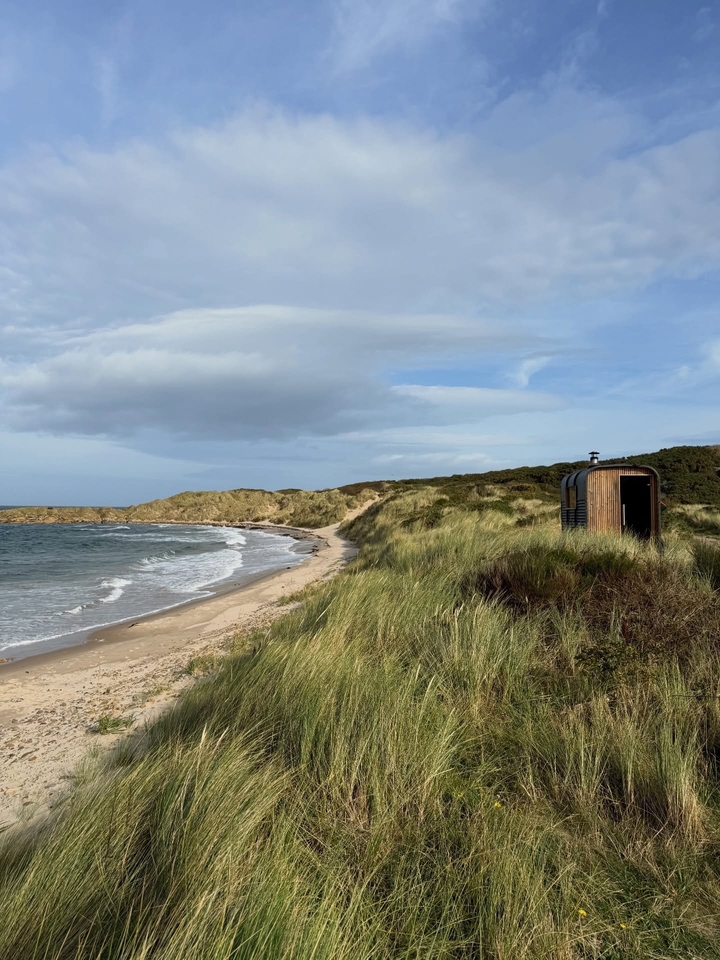 Fyrhus sauna nestled in sand dunes overlooking Hopeman East Beach on the Moray Firth