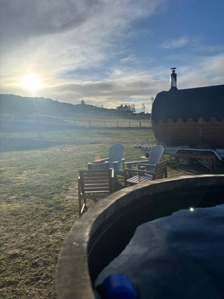 Fire pit and outdoor seating area at Pentland View Outdoor Sauna with cold plunge and hillside views