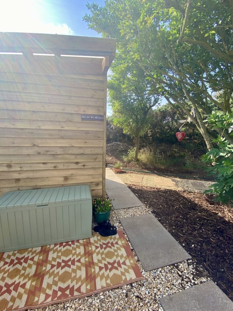 Pentland View Outdoor Sauna Edinburgh changing hut with "get yer kit aff" sign