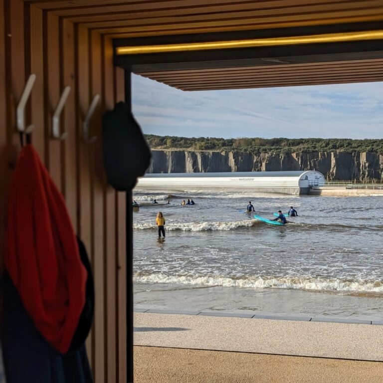 View from inside Spear Sauna overlooking the surf cove at Lost Shore in Edinburgh