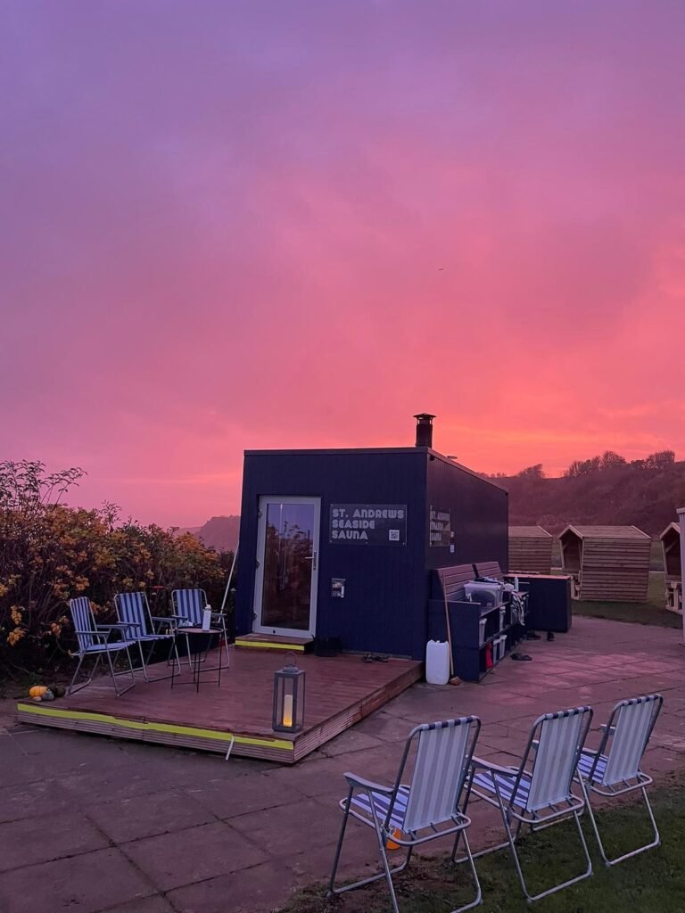 St Andrews Seaside Sauna with outdoor seating at sunset beside East Sands Beach