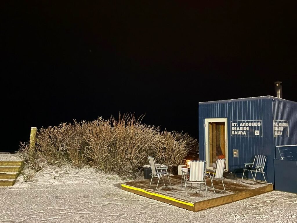 St Andrews Seaside Sauna at East Sands Beach at night time with views across the bay