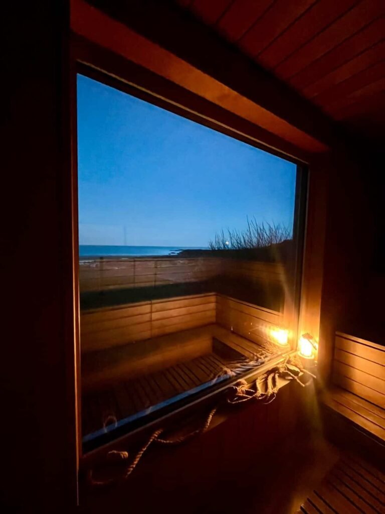 Entrance view into St Andrews Seaside Sauna showing wooden interior and seating