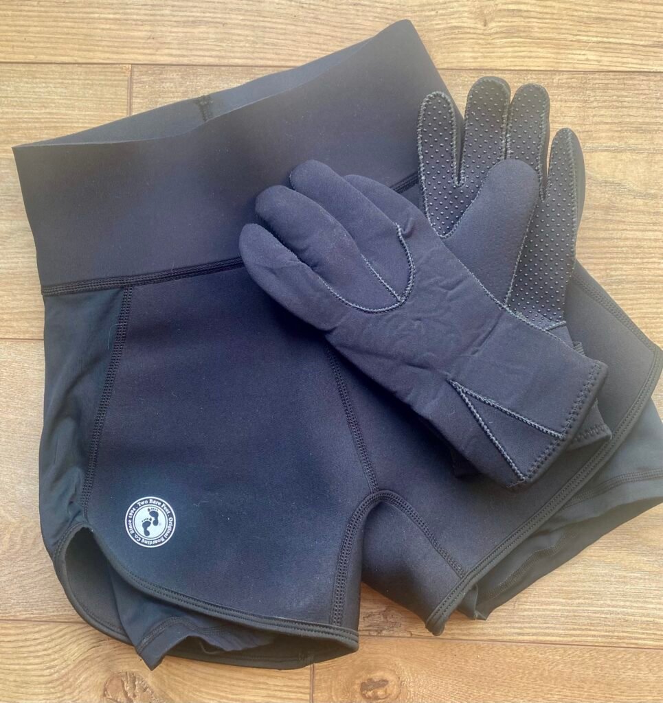 Neoprene gloves and shorts often used for wild swimming but not essential for most wild sauna visits