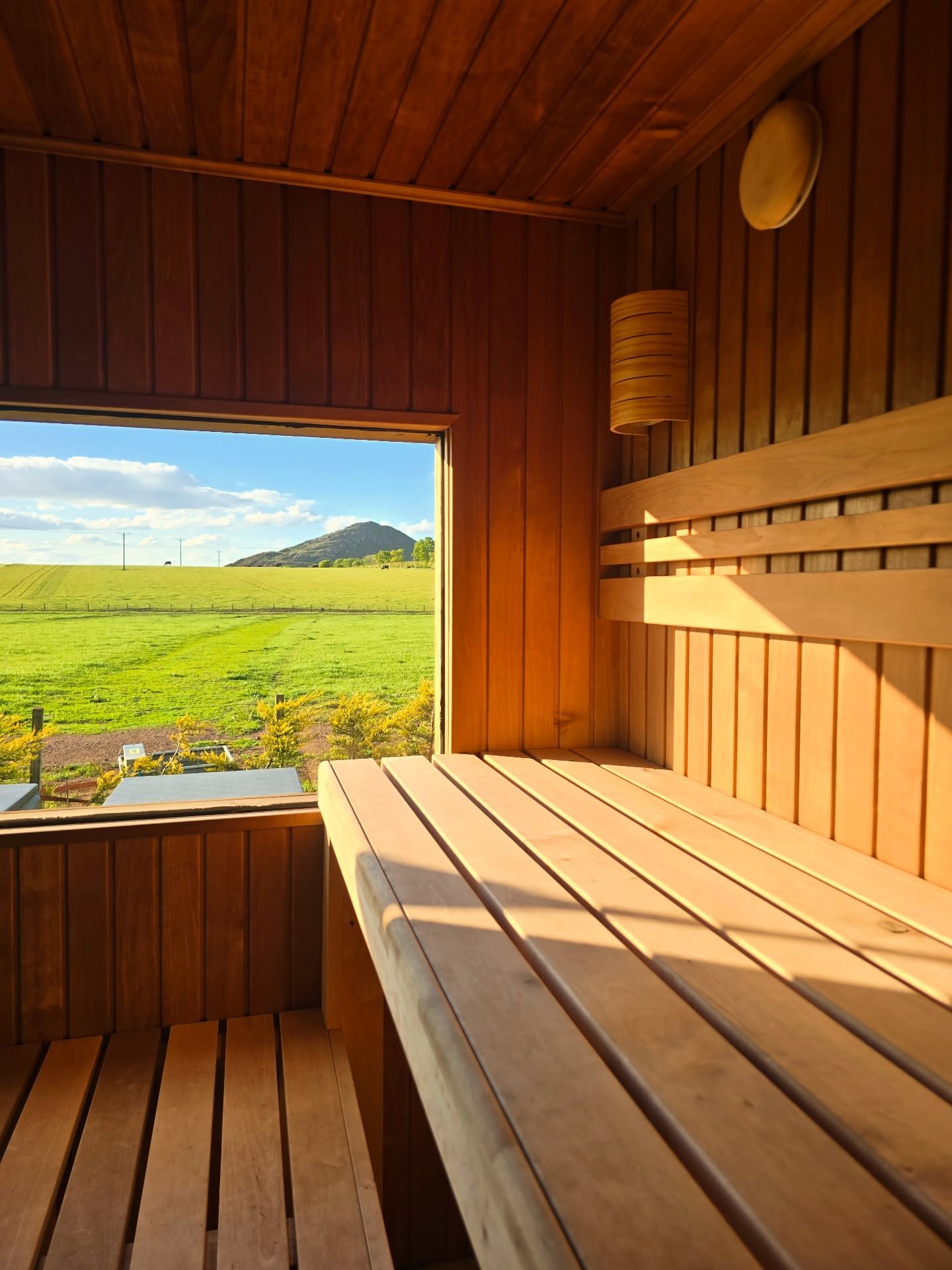 BYRE at Balgone sauna interior with large window looking out over East Lothian countryside and North Berwick Law