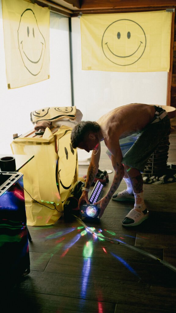 Dan Lawson setting up lights and flags inside the Celtic Sauna ahead of his rave Performance Aufguss at the 2026 UK Aufguss Championships