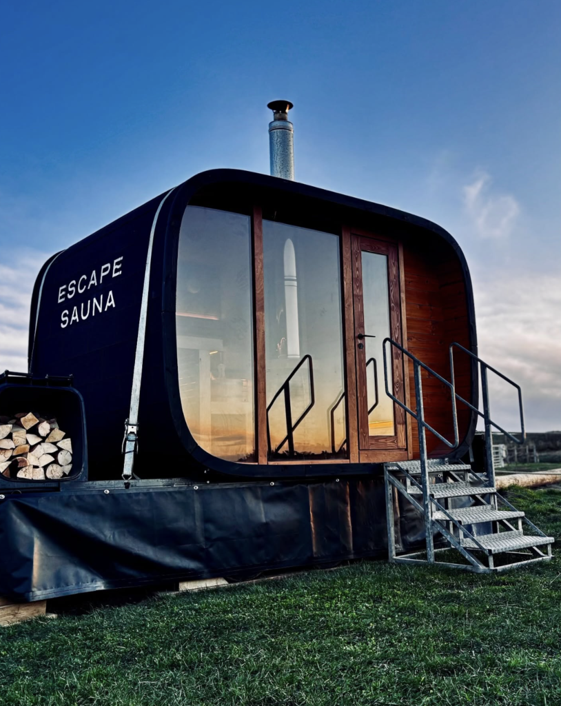 Escape Sauna North Berwick exterior with steps and Bass Rock in the background East Lothian