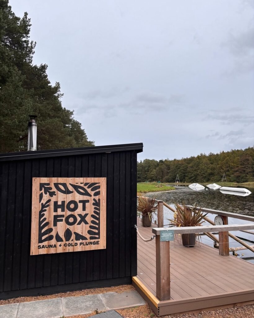 Hot Fox Foxlake sauna exterior sign beside the lake at Foxlake Adventures East Lothian