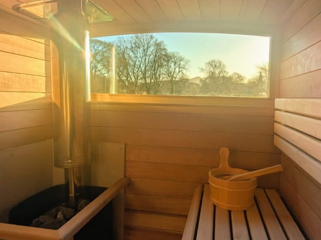 Inside the bothy sauna at Hot and Bothy looking out over the East Lothian countryside