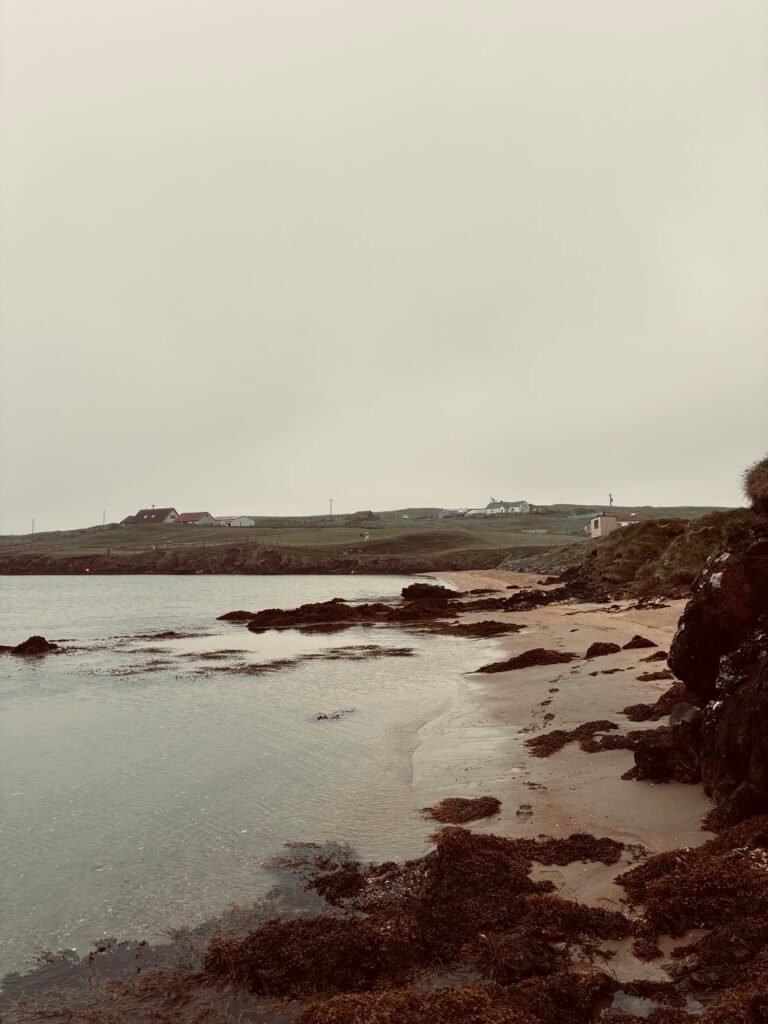 Rugged rocky coastline of Ollaberry Bay beach Shetland near Nordic Glow Shetland Hot Hoose sauna
