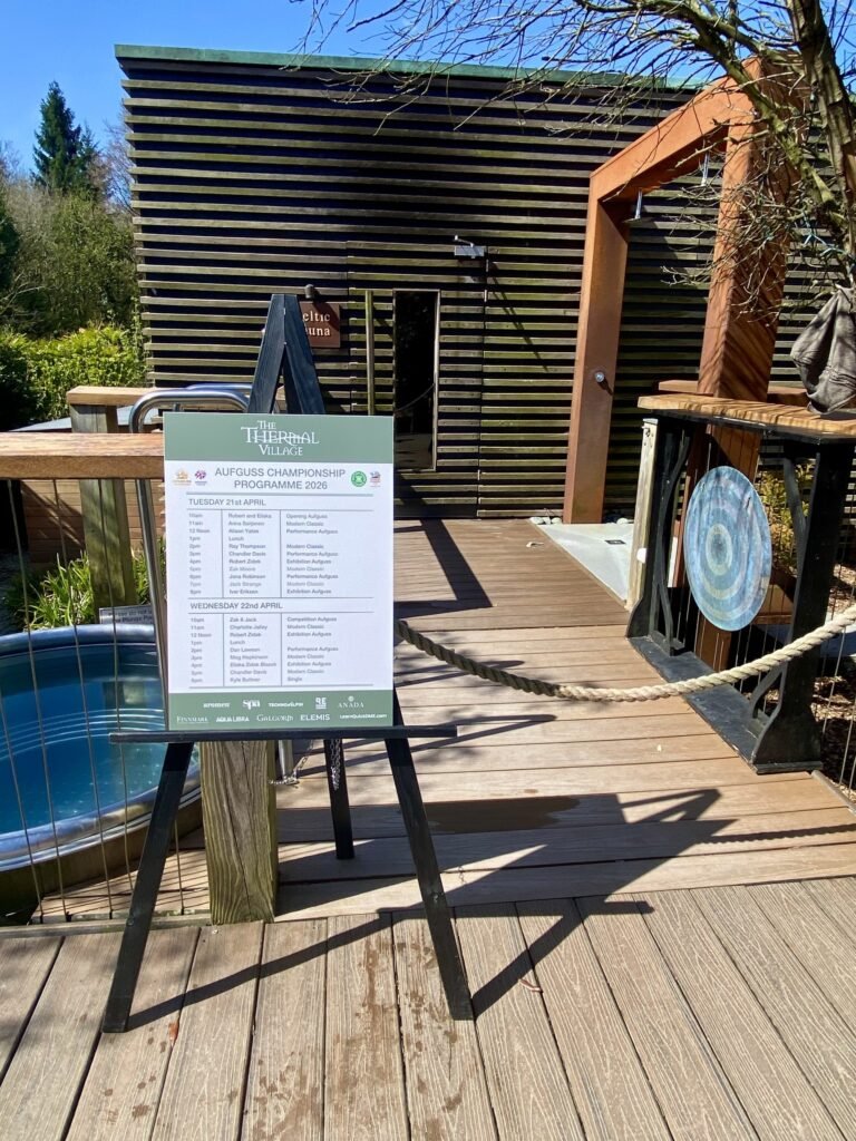 UK Aufguss Championships 2026 lineup board on easel beside gong outside the Celtic Sauna at Galgorm Resort