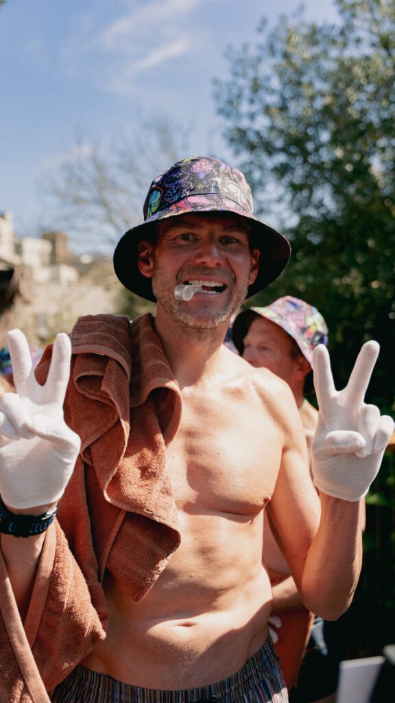 Attendee wearing bucket hat, white gloves and whistle ready for Dan Lawson's rave Aufguss at Galgorm