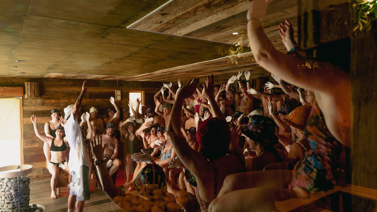 Crowd with hands in the air during Dan Lawson's rave Performance Aufguss at the 2026 UK Aufguss Championships at Galgorm Resort
