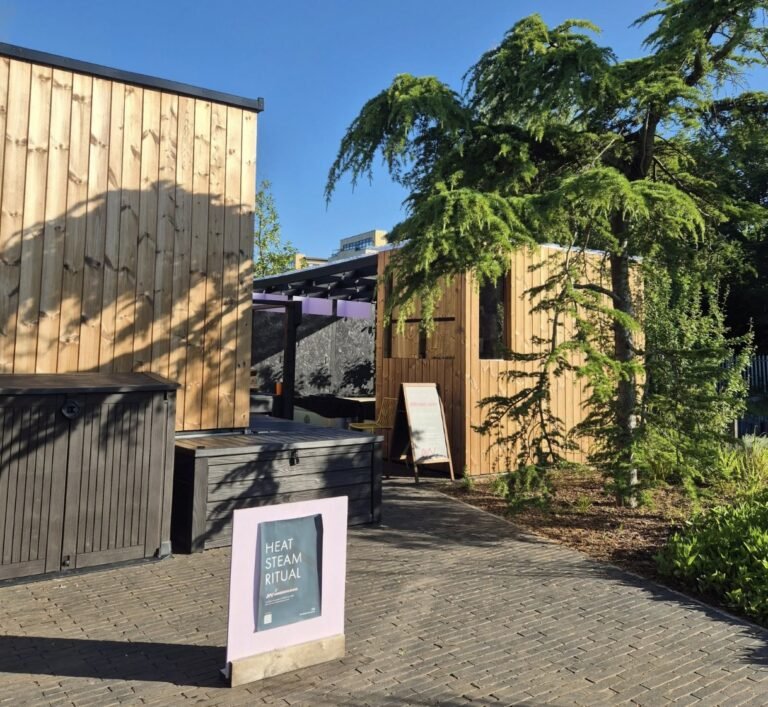 Amberwave Sauna Glasgow exterior with the hot tub and outdoor seating area