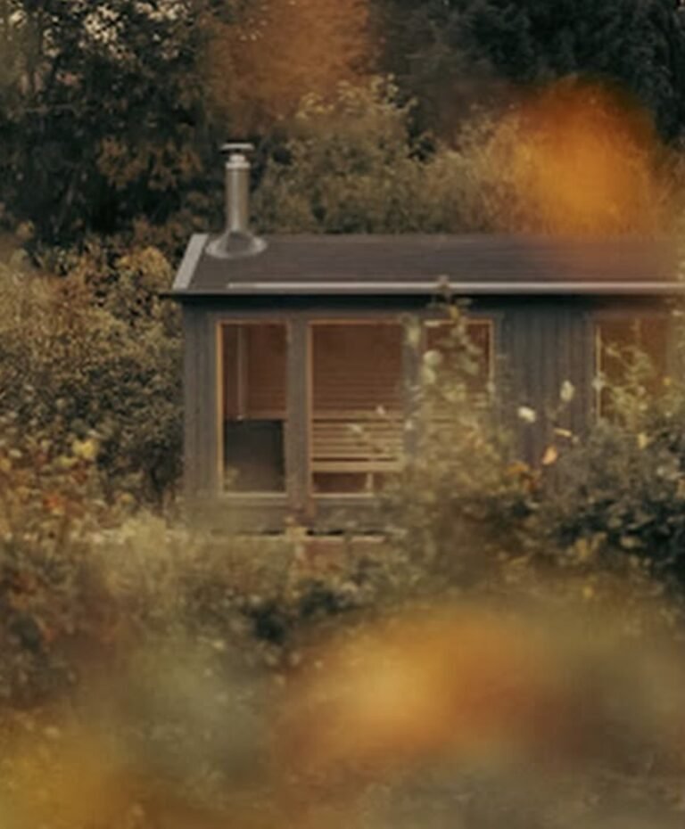 Ballintaggart Farm Sauna Pitlochry exterior seen through autumn foliage