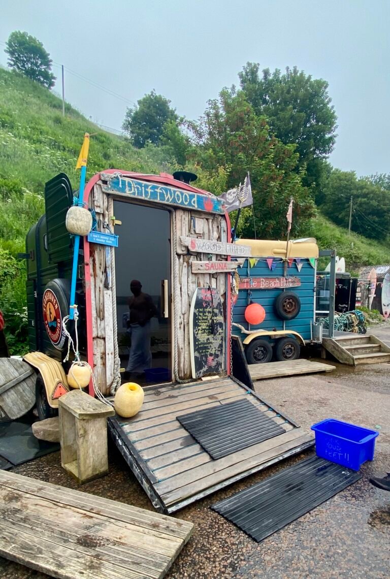 Driftwood Sauna Stonehave and changing area at Stonehaven Harbour, both decorated with reclaimed nets, buoys and driftwood