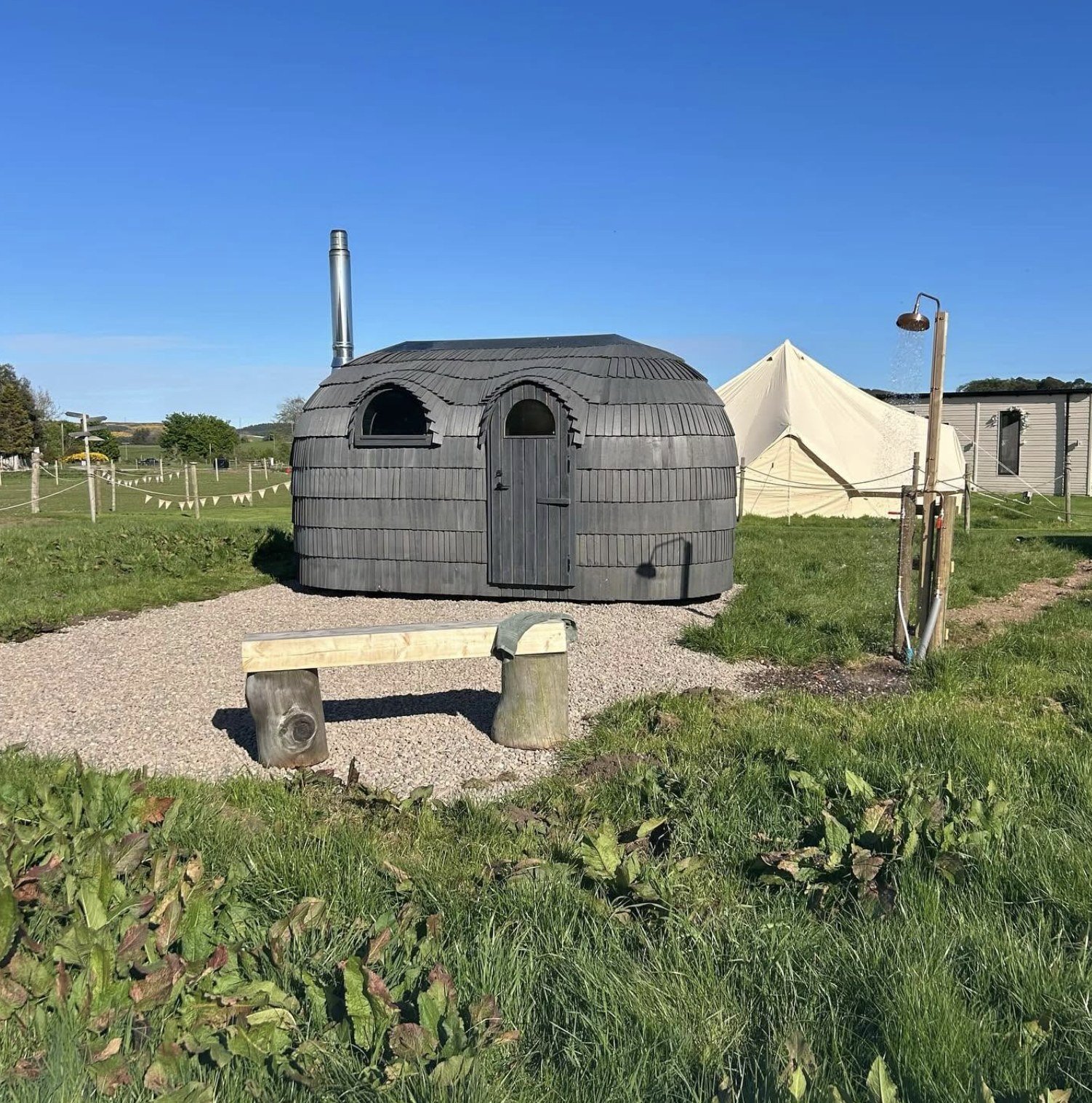 Maycroft Retreat Sauna Forgandenny exterior with its turf-style roof and arched windows