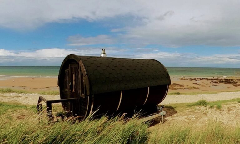 Sauna at the Kings Cullen exterior on the beach with the sea behind