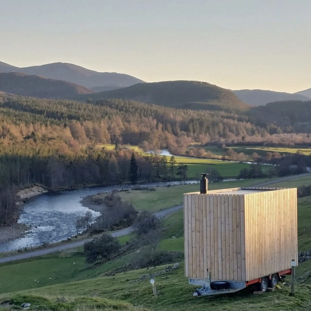 Stravaig Sauna Crathie overlooking the river valley at sunset near Crathie