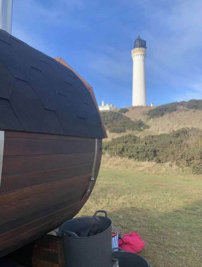 The Steamie Sauna Lossiemouth exterior with the Covesea lighthouse behind