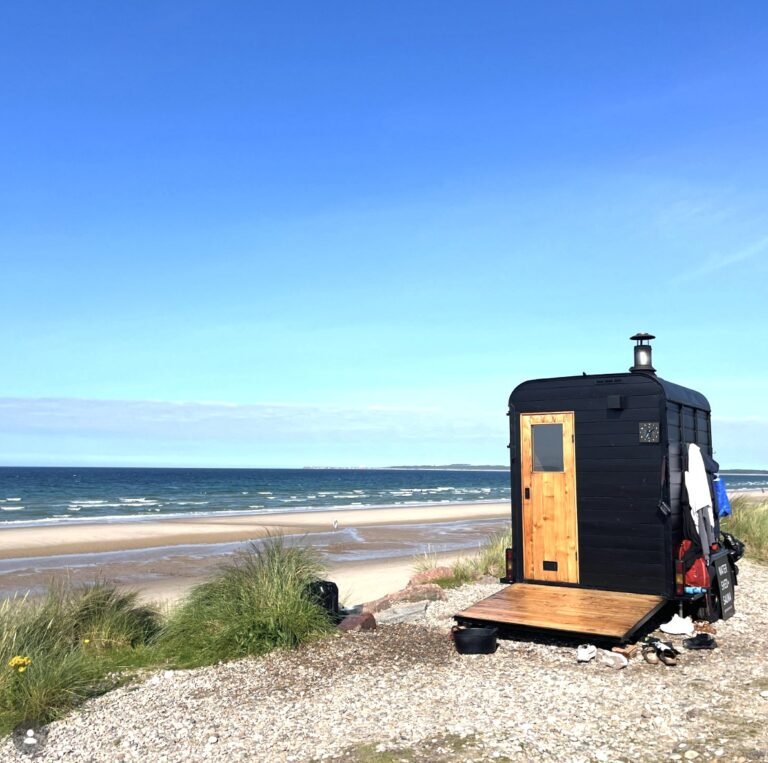 Watershed Sauna Findhorn on the beach with the door open on a clear day