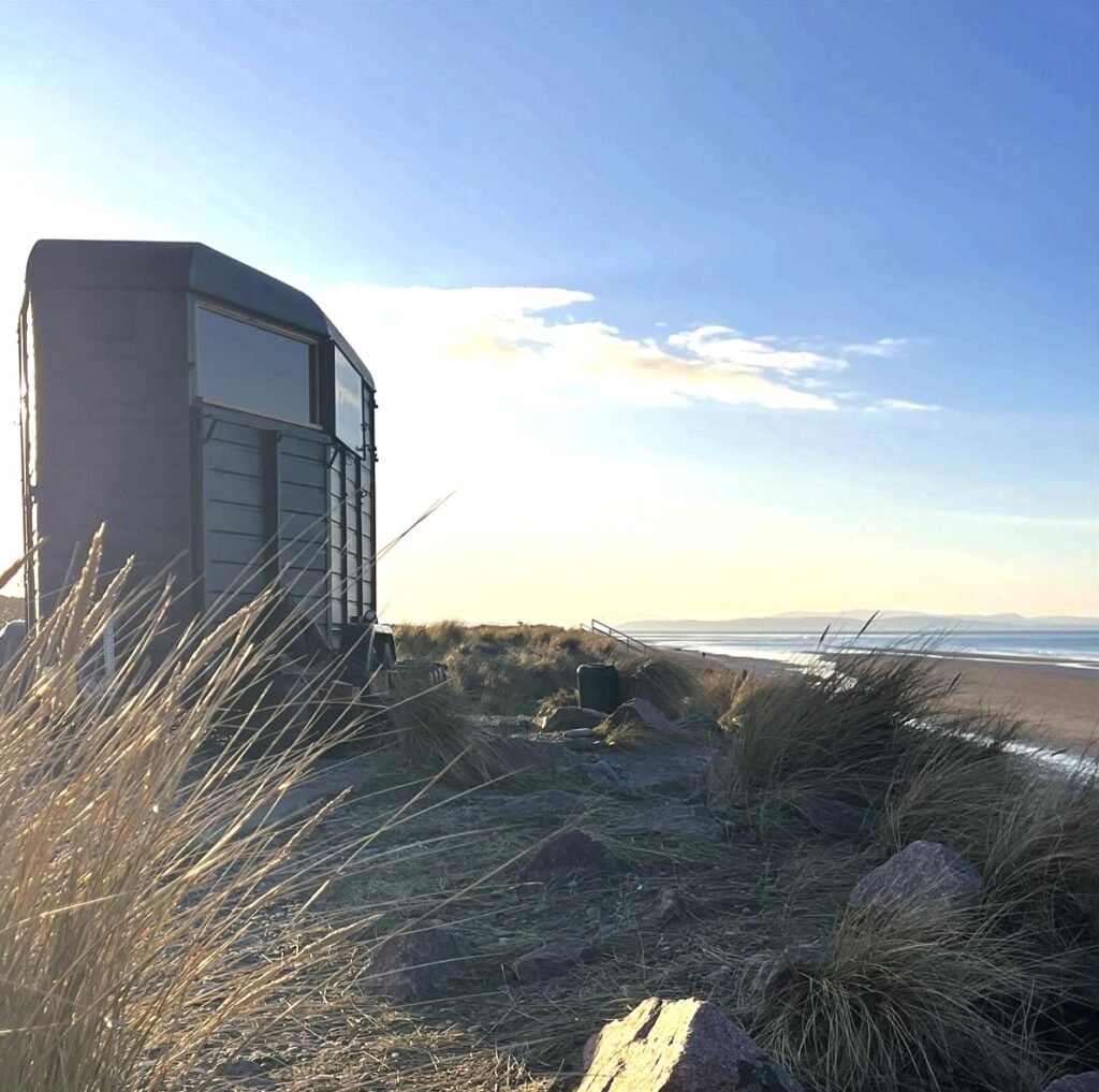 Watershed Sauna Findhorn at golden hour overlooking the beach