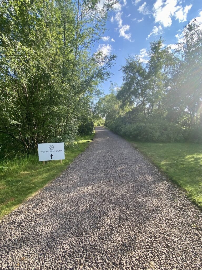 Wild Scottish Sauna Kinross entrance sign along the gravel path