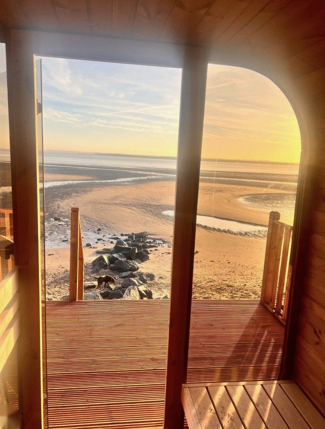 Seaway Sauna Monifieth doorway view over the beach at golden hour