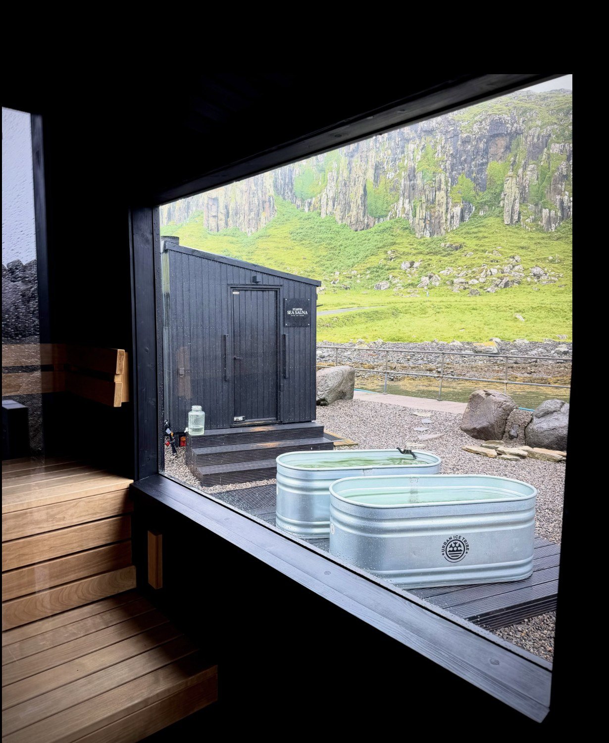 Staffin Sea Sauna Isle of Skye cabin with sign, sea plunge tubs and cliffs