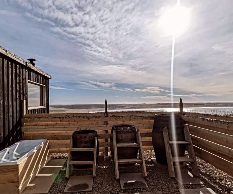 Seaview Sauna Dunnet Bay timber sauna cabin with an outdoor bath and three whisky barrel plunge tubs overlooking the bay